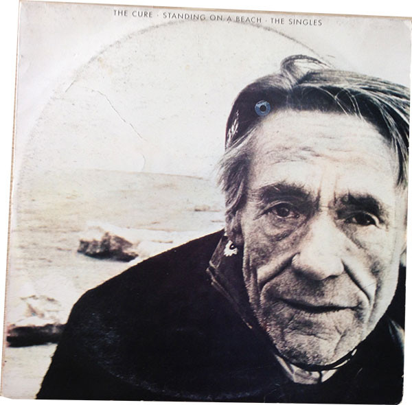 The Cure - The Singles Album Cover [Metaalprint]